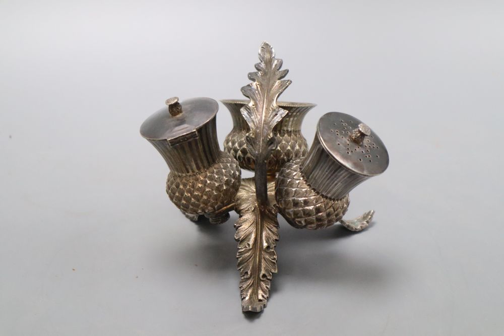 A Victorian electroplate thistle three piece cruet set, height 10cm